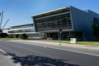 an empty street and an office building in the distance on a clear day in europe