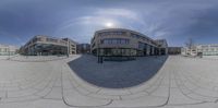 the exterior of a modern office building is being reflected by a 3d sphere mirror image