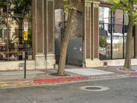 a store that is in a big city street with no cars on it, next to a fire hydrant