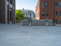 a street with a building near the building in the middle and on the left of which is a parking lot, as shown in this photo