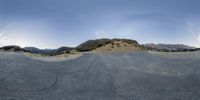 a 360 - fisheye view of the road, taken from the street level of the camera