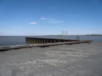 an old boat dock that is being partially destroyed by the water and surrounded by concrete