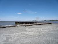 an old boat dock that is being partially destroyed by the water and surrounded by concrete