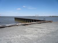 an old boat dock that is being partially destroyed by the water and surrounded by concrete