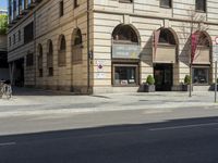 an old building is being used for the advertising purposes of a bike lane on the street