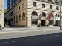 an old building is being used for the advertising purposes of a bike lane on the street