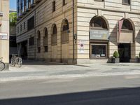 an old building is being used for the advertising purposes of a bike lane on the street