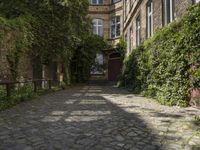 the walkway is paved with cobblestones that give an old building some serious look