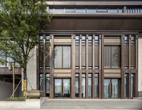 an old building that is surrounded by trees and stairs outside of it is made of wood