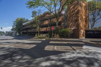 a street view of the side of a building at a crosswalk or the corner