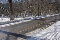 Snowy Road through Ontario Forest in Canada