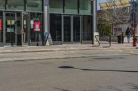 a man with a red fire hydrant and skateboard in the middle of an empty city street