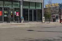 a man with a red fire hydrant and skateboard in the middle of an empty city street