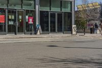 a man with a red fire hydrant and skateboard in the middle of an empty city street