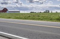 Road in Ontario countryside with trees and blue sky