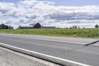 Road in Ontario countryside with trees and blue sky