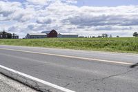 Road in Ontario countryside with trees and blue sky