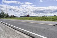 Road in Ontario countryside with trees and blue sky