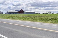 Road in Ontario countryside with trees and blue sky