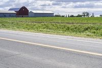 Road in Ontario countryside with trees and blue sky