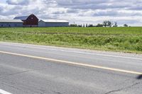 Road in Ontario countryside with trees and blue sky