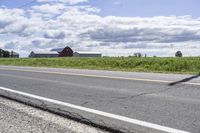 Road in Ontario countryside with trees and blue sky