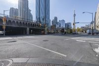 the street view in a city shows a car on a crosswalk in a busy city