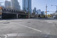 the street view in a city shows a car on a crosswalk in a busy city