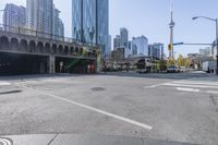 the street view in a city shows a car on a crosswalk in a busy city