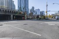 the street view in a city shows a car on a crosswalk in a busy city