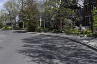 empty street with some residential neighborhood in the background in early springtime on clear day