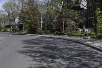 empty street with some residential neighborhood in the background in early springtime on clear day