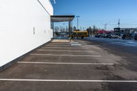 a parking lot has been paved with white paint, and lines show on the floor