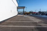 a parking lot has been paved with white paint, and lines show on the floor