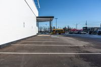 a parking lot has been paved with white paint, and lines show on the floor