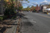 the white lines in the street are marked with paint on it to indicate how to park