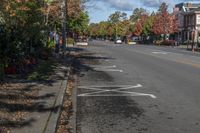 the white lines in the street are marked with paint on it to indicate how to park