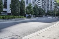 a car driving down an empty street lined with tall buildings and trees in the background