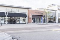 this is a view of a street in a business area with the name lanswood