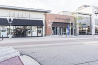 this is a view of a street in a business area with the name lanswood