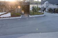 there is an open air lift ramp on the street in front of a garage area