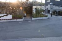 there is an open air lift ramp on the street in front of a garage area