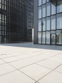 an open courtyard is situated between two buildings in a city park or an office complex