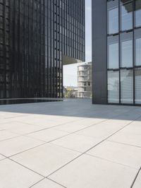 an open courtyard is situated between two buildings in a city park or an office complex