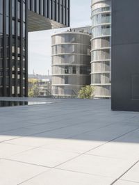 an open courtyard is situated between two buildings in a city park or an office complex