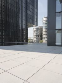 an open courtyard is situated between two buildings in a city park or an office complex