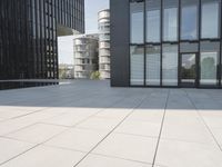an open courtyard is situated between two buildings in a city park or an office complex