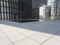 an open courtyard is situated between two buildings in a city park or an office complex