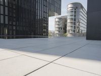 an open courtyard is situated between two buildings in a city park or an office complex