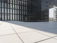 an open courtyard is situated between two buildings in a city park or an office complex